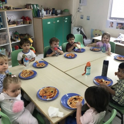 Enjoying our pizzas for snack!