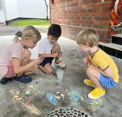 Wilma, Luca and bingo having fun with chalks.