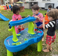 Xiao Yan and Trevor exploring our new water play set. Thank you Oscar and Margot .