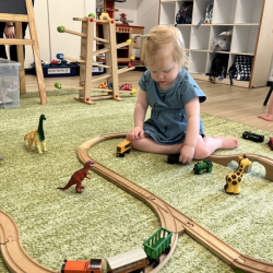 Isabelle playing with the train tracks!
