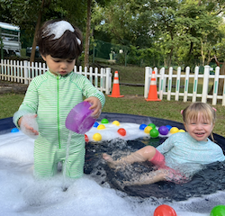 Bubble bath or pool!? Izzy and Milan having so much fun during splash time!.