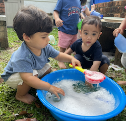 Mateo and Milan enjoying playing with the soapy water!