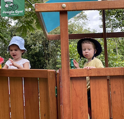Margot and George playing on the pirate ship.