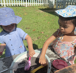 Leela and Allie had fun mixing, pouring and scooping in the mud kitchen today.
