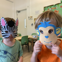 The monkey and the zebra had great fun playing at school today.
