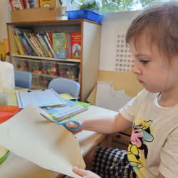 Clara being very focused in her cutting. 