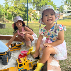 Having fun at sand play outdoors.