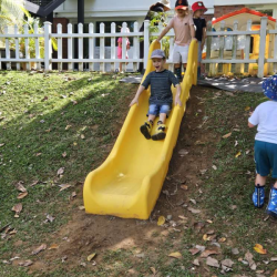The children were eager to go on the slide.