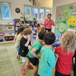 We enjoy music and movement with laoshi.