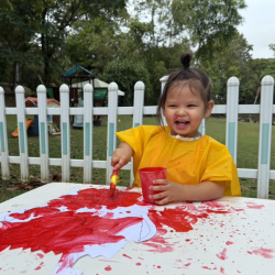 Amelia enjoying painting the red colour monster!