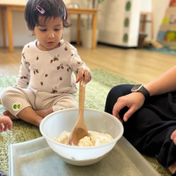 Niva Aria helping to stir the Playdough ingredients together!