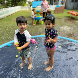 Milan and Kainaat enjoying water play. 