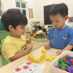 Milan and Nate counting the yellow bears together.