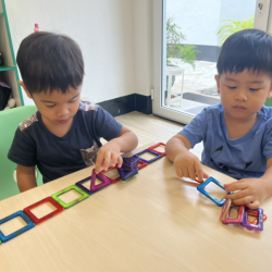  Wesley and Matteo having fun with magnets.