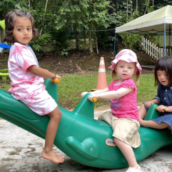 Imaan, Edwina, and Celene having fun on the see-saw!