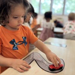 Cru having fun with cars and tracks while learning about numbers!