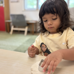 Lulu making a clay heart!