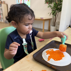 Malhar painting her orange! 🍊