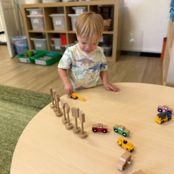 Max helping to set up for our small world play