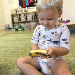 Noah helping to remove the peel for our banana bread!