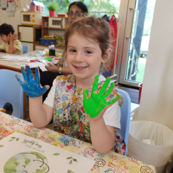 Evie happy with her earth day craft