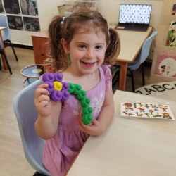 Evie made a flower with some help.