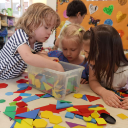 Sophia C, Sophia R and Sophie working on the shapes manipulatives together.