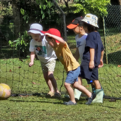 The boys enjoying a friendly football match.