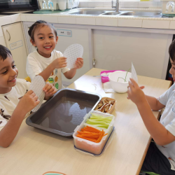 The boys were intrigued by the rice paper.