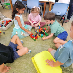 The children are getting creative with their buildings.