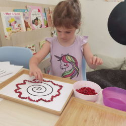 We used the red saga seeds we picked from the garden to work on patterns