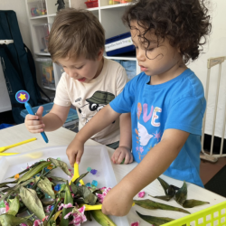 Alba and Alex having fun exploring flower parts.