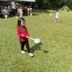 Celene doing a great job focusing on the game, not to spill water.