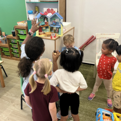 Dragonflies listening to Ms Jenny's story on the doll house. 