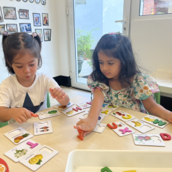 Eden and Kainaat having fun recognising their alphabets with matching activity. 