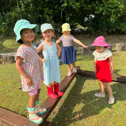 Girls enjoying balancing in the balancing beam. 