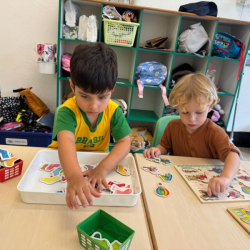 Kingston and Milan having fun with table top activities.