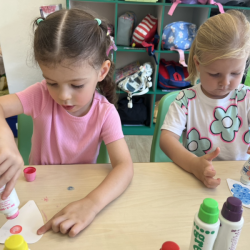Klaudia and Eleanor doing a great job with their Mother’s Day craft. .png