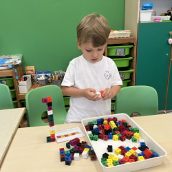 Leo having fun with cube connectors.
