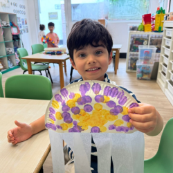 Milan proud of his masterpiece- paper plate jellyfish 