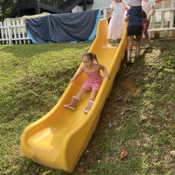 Roux sliding into fun on a sunny outdoor adventure!