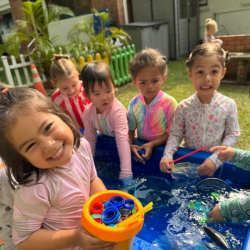 Splashing fun with friends at the water play station!