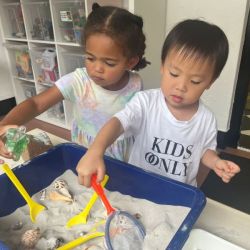 Amara and Nate having a great time exploring the sand tray.
