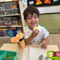 Xiang enjoying his snack with friends.