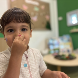 Laleh having so much fun with dot stickers. 