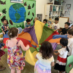 Busy Bees having fun with parachute game.