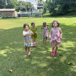 Girls hopping like a Kangaroo around the garden.