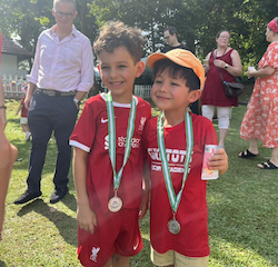 Luca and Alex happy with their medals.