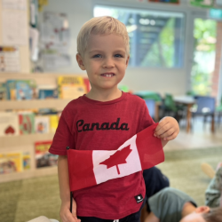 Rowan proudly and confidently sharing about his countries flag, Canada .