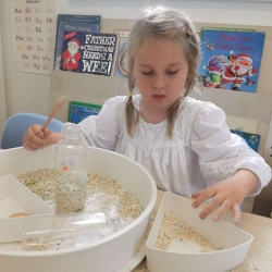 Izzy exploring the sensory tray